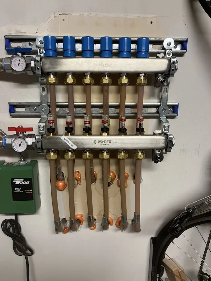 Plumber performing Water Heater Repair at a residential property in Medford